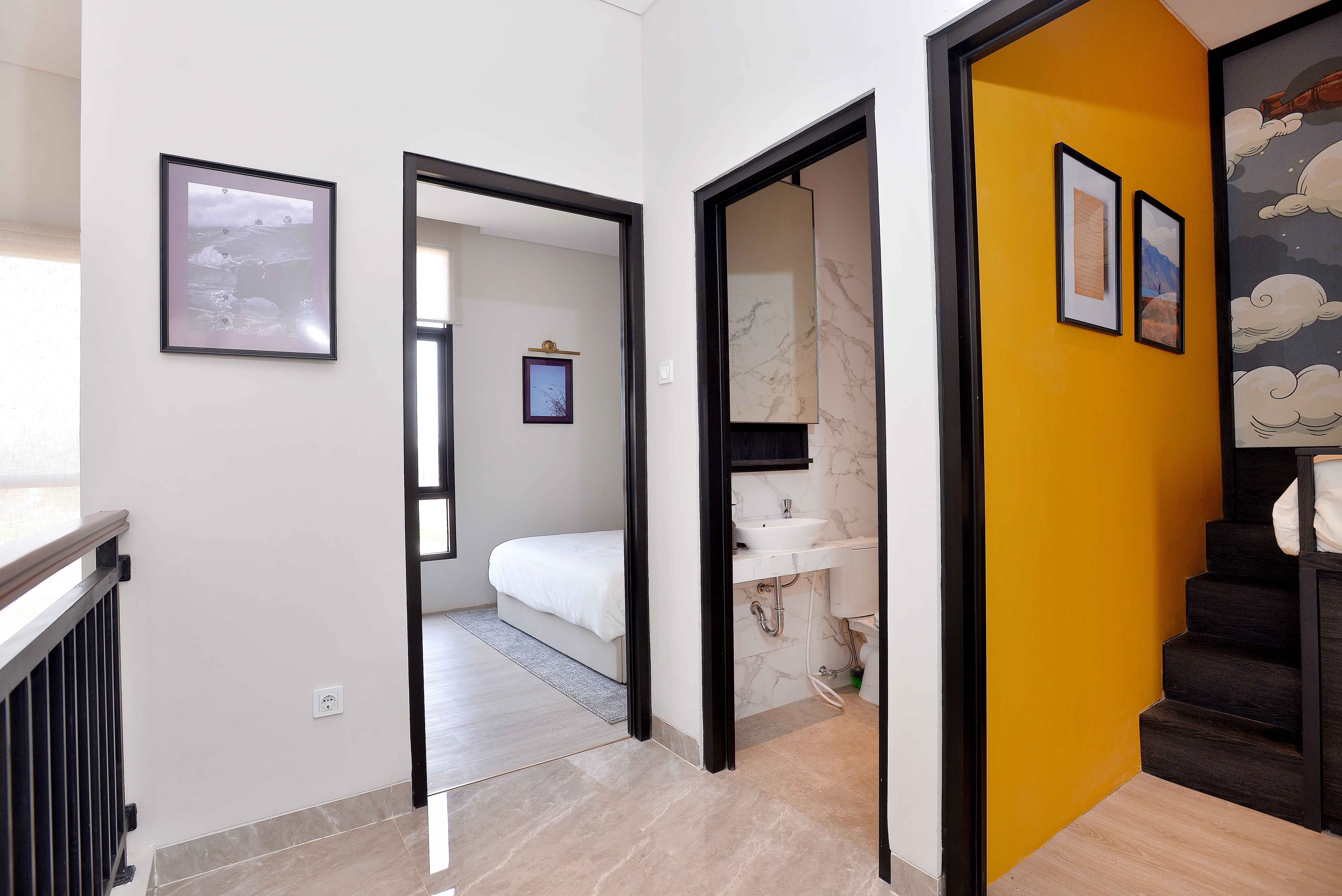 Interior view of a modern bedroom with a bed and decorative items